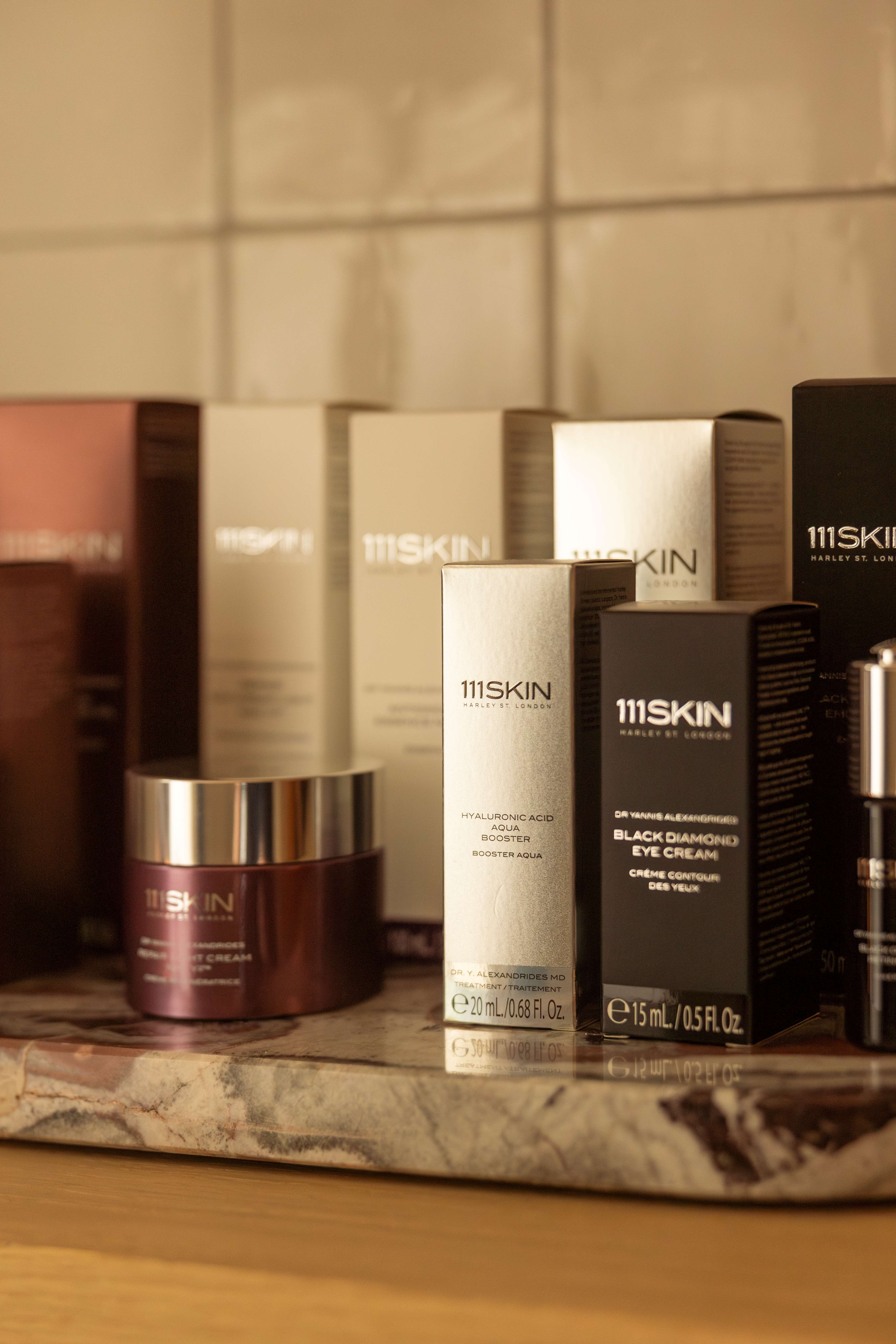 Assortment of 111Skin luxury skincare products, featuring various serums, creams, and eye treatments.