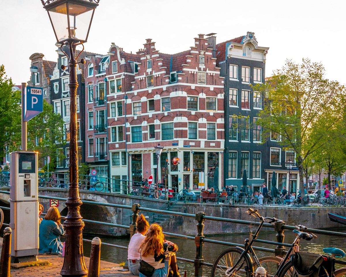 An image of Amsterdam, Netherlands, highlighting the city's beautiful waterways and classic architecture.