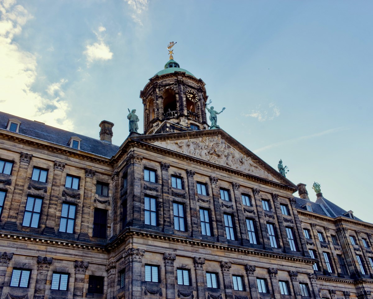 A view of the royal palace in Amsterdam, highlighting its majestic facade and cultural importance as a landmark.